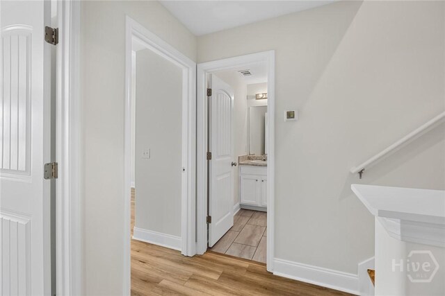13 Abaco Ct, Savannah, GA 31419 - corridor with light wood-style flooring and baseboards