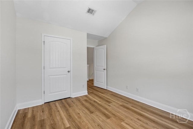 13 Abaco Ct, Savannah, GA 31419 - unfurnished bedroom featuring light wood-type flooring and lofted ceiling