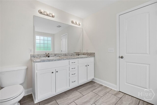 13 Abaco Ct, Savannah, GA 31419 - full bathroom with double vanity and wood finished floors