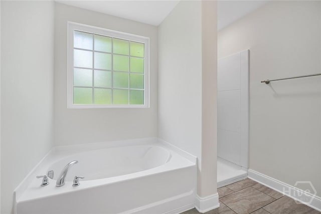 13 Abaco Ct, Savannah, GA 31419 - bathroom featuring plenty of natural light, a garden tub, a shower, and tile patterned floors