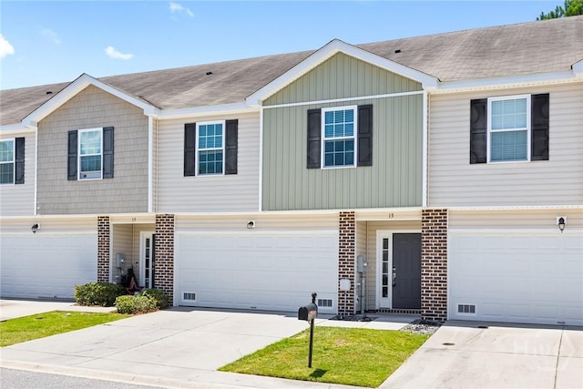 13 Abaco Ct, Savannah, GA 31419 - townhome / multi-family property featuring brick siding, driveway, board and batten siding, and an attached garage