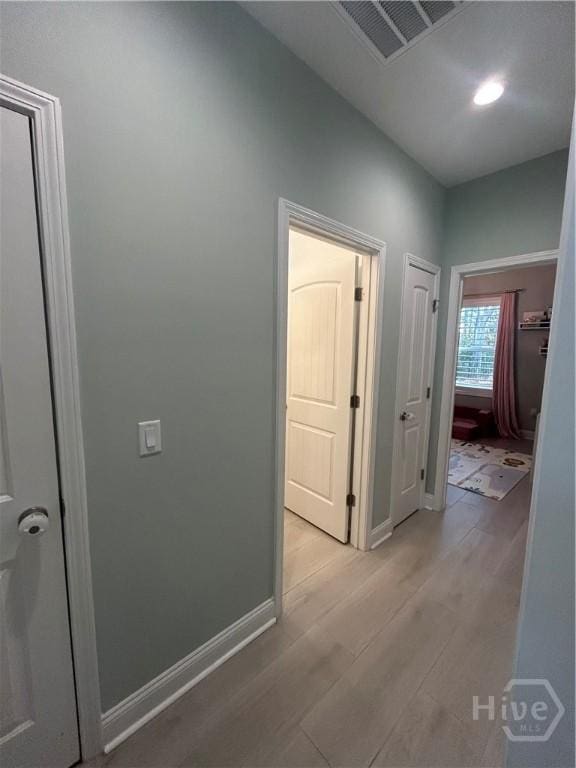 275 Heron Ct, Saint Marys, GA 31558 - hall featuring light wood-style flooring and baseboards