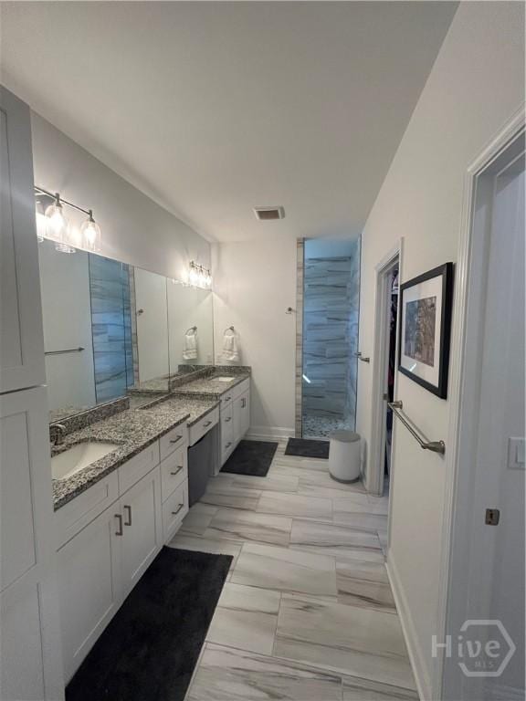 275 Heron Ct, Saint Marys, GA 31558 - full bathroom with vanity, tiled shower, and marble finish floors