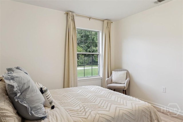 4 Jackson Ct, Savannah, GA 31405 - bedroom featuring multiple windows and wood finished floors