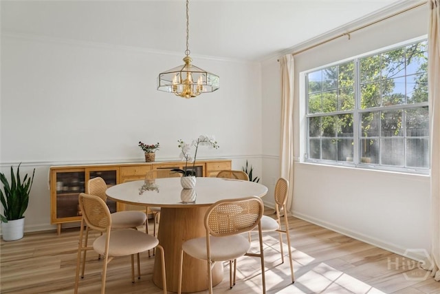4 Jackson Ct, Savannah, GA 31405 - dining area featuring a chandelier, light wood-style flooring, beverage cooler, and ornamental molding