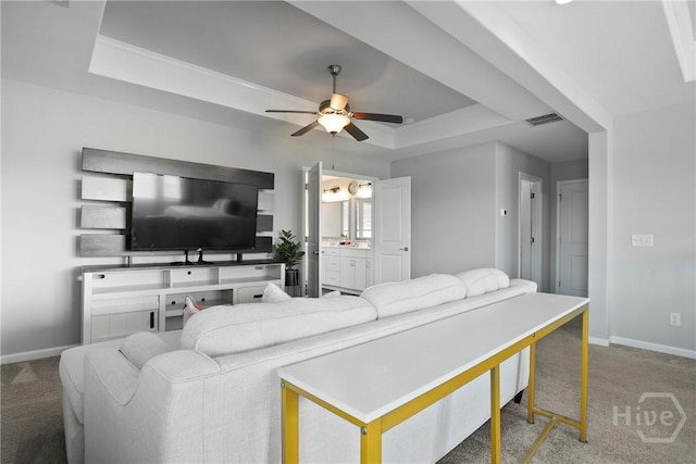 11 Shoefstall St, Savannah, GA 31407 - carpeted living area with a raised ceiling and ceiling fan