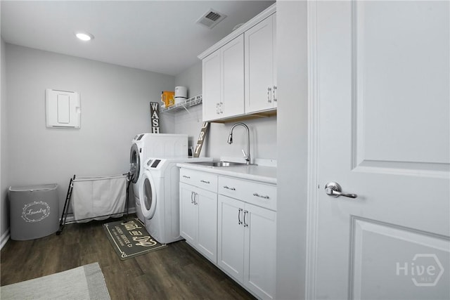 11 Shoefstall St, Savannah, GA 31407 - laundry area with cabinet space, washing machine and clothes dryer, dark wood finished floors, and recessed lighting