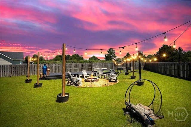 11 Shoefstall St, Savannah, GA 31407 - yard at dusk with an outdoor fire pit