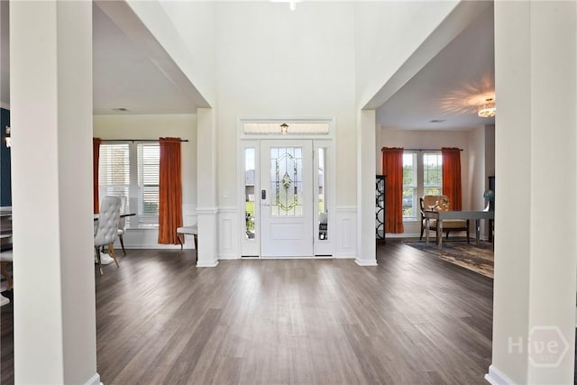 11 Shoefstall St, Savannah, GA 31407 - foyer entrance featuring wood finished floors, a decorative wall, and wainscoting
