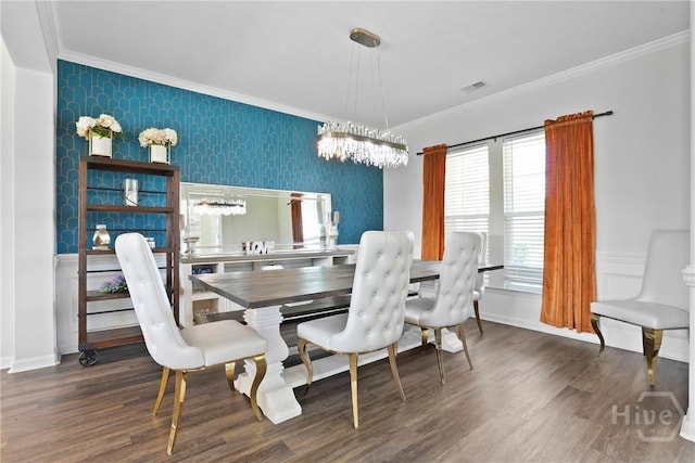 11 Shoefstall St, Savannah, GA 31407 - dining room with wallpapered walls, crown molding, wood finished floors, and a chandelier