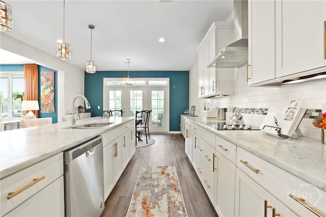 11 Shoefstall St, Savannah, GA 31407 - kitchen with stainless steel dishwasher, wall chimney exhaust hood, french doors, healthy amount of natural light, and recessed lighting