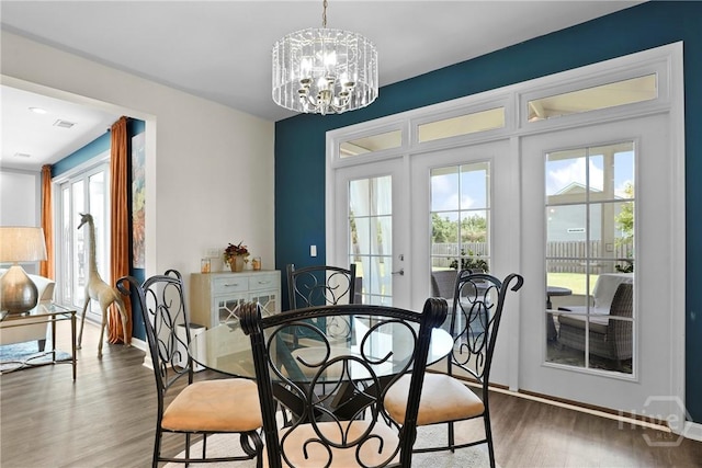 11 Shoefstall St, Savannah, GA 31407 - dining area with a chandelier, wood finished floors, and french doors