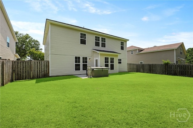 30 Melody Dr, Pooler, GA 31322 - rear view of house with a hot tub and a fenced backyard