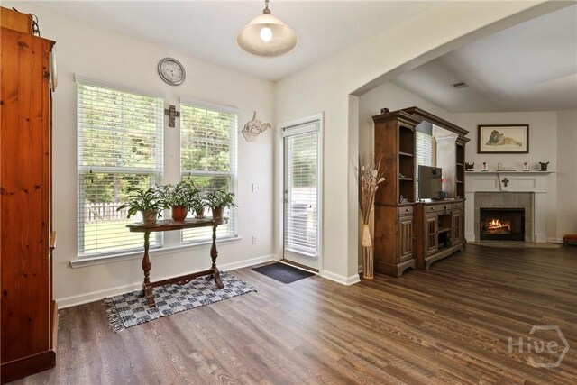 30 Melody Dr, Pooler, GA 31322 - entryway with dark wood finished floors, a tile fireplace, and arched walkways