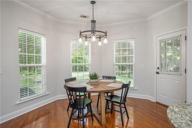 210 Windsong Dr, Richmond Hill, GA 31324 - dining room with a chandelier, dark wood finished floors, ornamental molding, and plenty of natural light