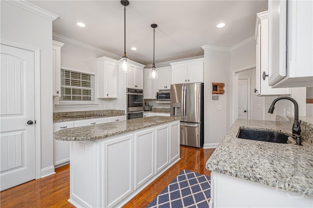 210 Windsong Dr, Richmond Hill, GA 31324 - kitchen with stainless steel appliances, white cabinetry, a center island, dark wood-type flooring, and recessed lighting