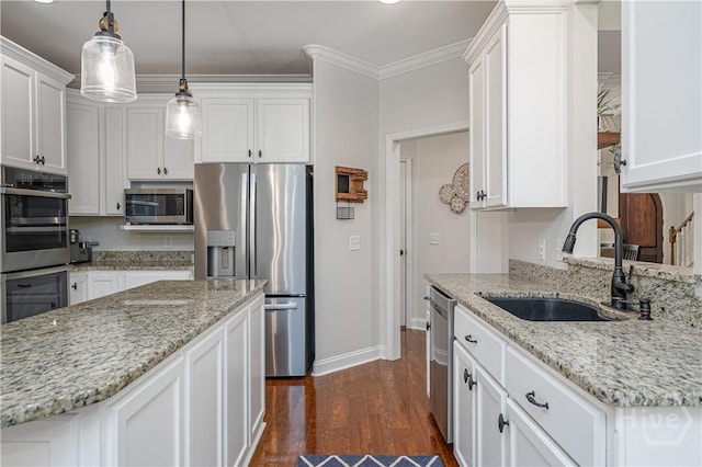 210 Windsong Dr, Richmond Hill, GA 31324 - kitchen featuring stainless steel appliances, white cabinetry, dark wood finished floors, pendant lighting, and light stone countertops