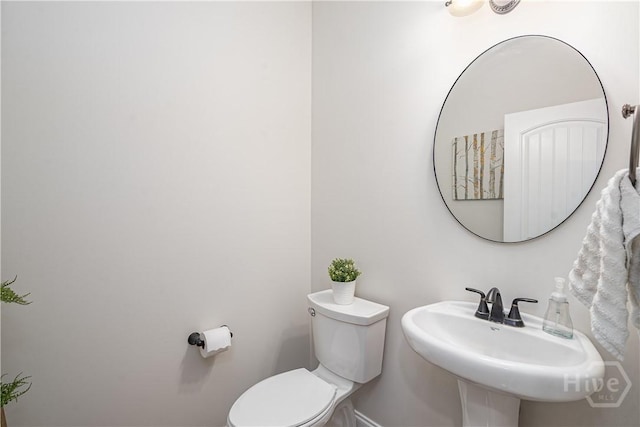 210 Windsong Dr, Richmond Hill, GA 31324 - half bath featuring baseboards and toilet