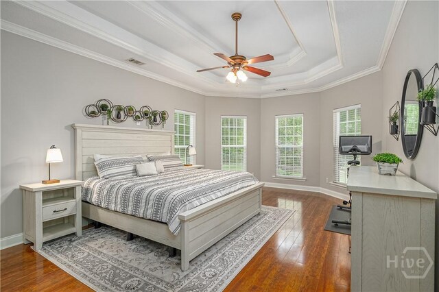 210 Windsong Dr, Richmond Hill, GA 31324 - bedroom featuring a raised ceiling, hardwood / wood-style floors, crown molding, and a ceiling fan
