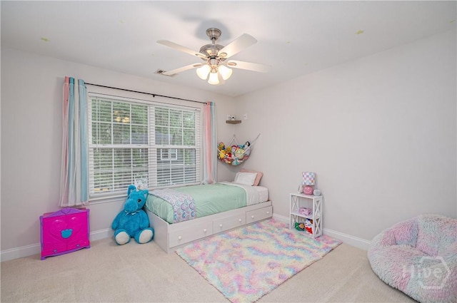 210 Windsong Dr, Richmond Hill, GA 31324 - carpeted bedroom featuring baseboards and ceiling fan