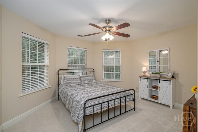 210 Windsong Dr, Richmond Hill, GA 31324 - carpeted bedroom with baseboards and a ceiling fan