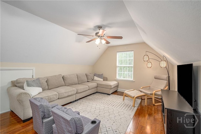 210 Windsong Dr, Richmond Hill, GA 31324 - living room with wood finished floors, a ceiling fan, and vaulted ceiling