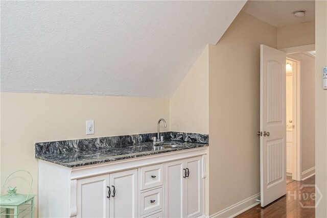 210 Windsong Dr, Richmond Hill, GA 31324 - bathroom featuring wood finished floors, lofted ceiling, and vanity