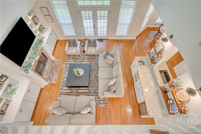 210 Windsong Dr, Richmond Hill, GA 31324 - living area featuring a towering ceiling and french doors