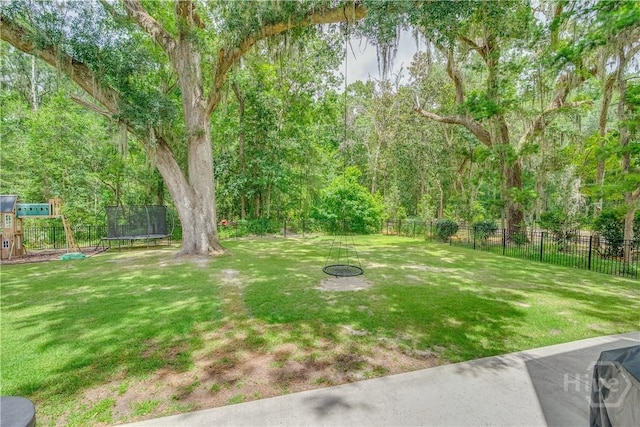 210 Windsong Dr, Richmond Hill, GA 31324 - view of yard featuring a trampoline