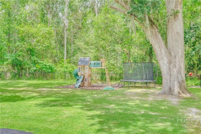 210 Windsong Dr, Richmond Hill, GA 31324 - view of yard with a trampoline and a playground