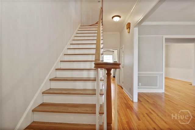 536 E Harris St, Savannah, GA 31401 - stairway featuring crown molding and wood finished floors
