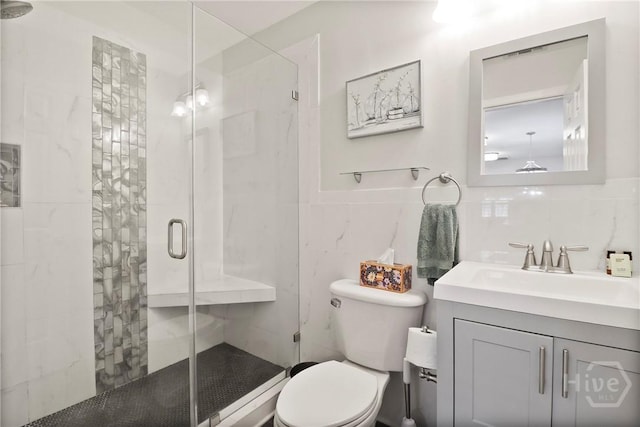 536 E Harris St, Savannah, GA 31401 - full bathroom featuring tile walls, vanity, and a shower stall