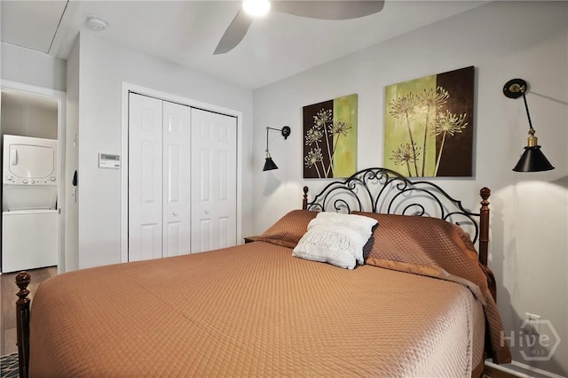 536 E Harris St, Savannah, GA 31401 - bedroom featuring stacked washer / drying machine, a closet, and a ceiling fan
