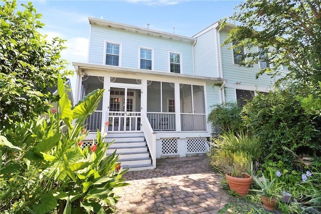 536 E Harris St, Savannah, GA 31401 - view of front of home with a sunroom and stairway