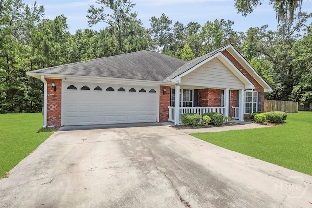 140 Kettle Creek Ln, Midway, GA 31320 - ranch-style house with brick siding, covered porch, a garage, driveway, and roof with shingles