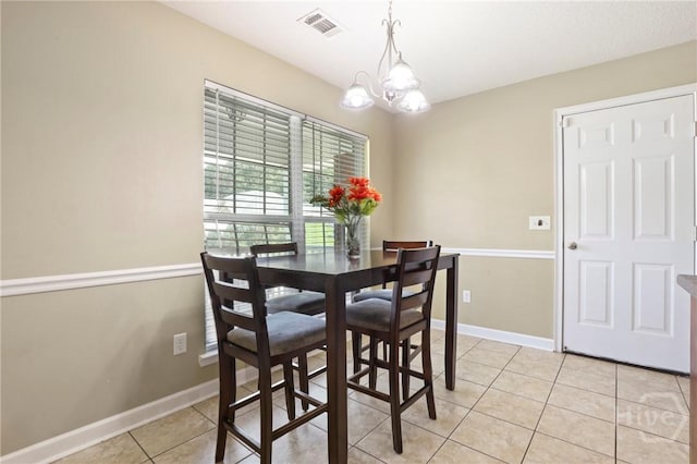 140 Kettle Creek Ln, Midway, GA 31320 - dining room featuring light tile patterned floors and a chandelier