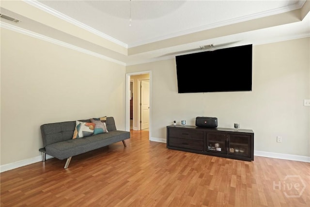 140 Kettle Creek Ln, Midway, GA 31320 - sitting room featuring light wood-type flooring, a tray ceiling, and ornamental molding