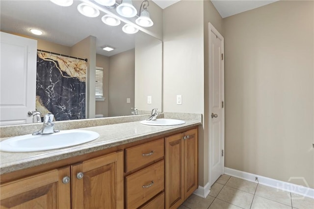140 Kettle Creek Ln, Midway, GA 31320 - bathroom with double vanity and tile patterned flooring