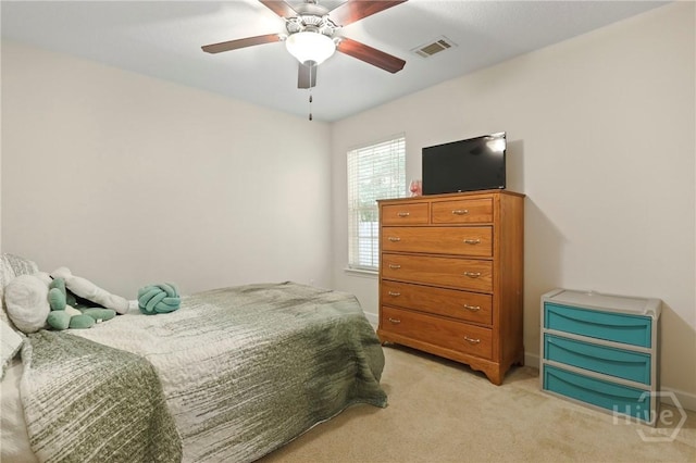 140 Kettle Creek Ln, Midway, GA 31320 - bedroom with light colored carpet and a ceiling fan