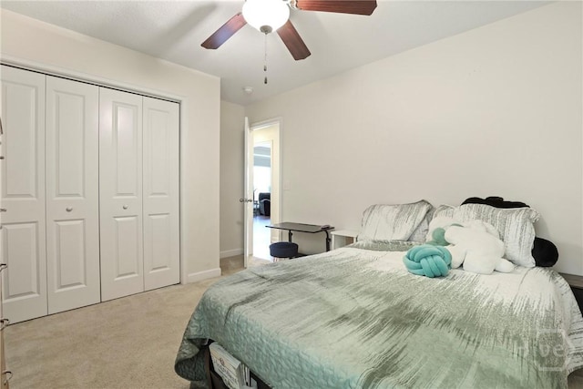 140 Kettle Creek Ln, Midway, GA 31320 - bedroom with light colored carpet, a closet, and a ceiling fan