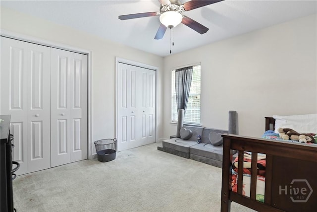 140 Kettle Creek Ln, Midway, GA 31320 - bedroom featuring carpet floors, two closets, and ceiling fan