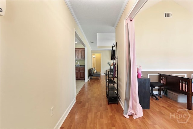 140 Kettle Creek Ln, Midway, GA 31320 - hallway featuring light wood-type flooring and crown molding