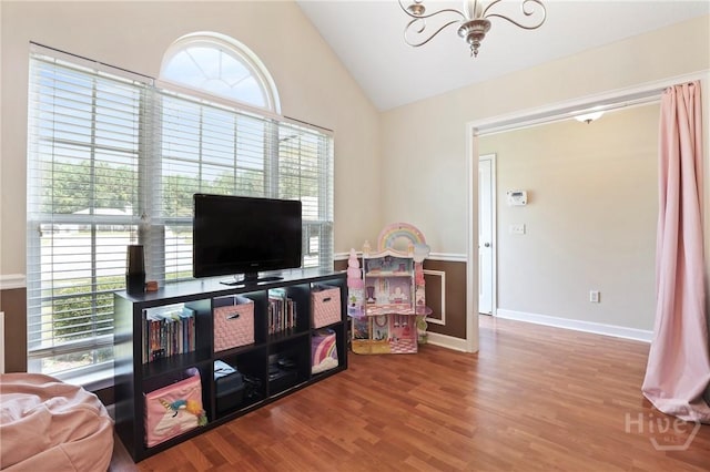 140 Kettle Creek Ln, Midway, GA 31320 - living area featuring healthy amount of natural light, a chandelier, lofted ceiling, and wood finished floors