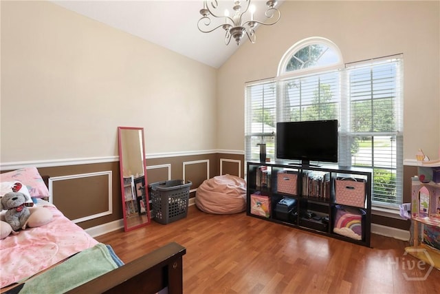 140 Kettle Creek Ln, Midway, GA 31320 - bedroom featuring a chandelier, wood finished floors, wainscoting, and high vaulted ceiling