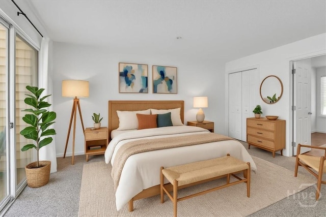 3005 River Dr Unit 302, Savannah, GA 31404 - carpeted bedroom featuring baseboards and a closet