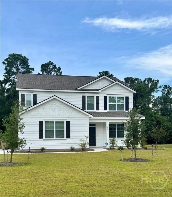 756 Logging Hill Dr, Richmond Hill, GA 31324 - view of front facade with a front yard and roof with shingles