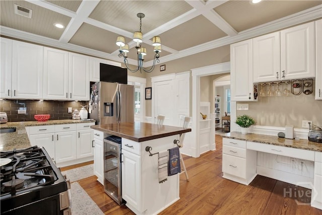 1507 E 49th St, Savannah, GA 31404 - kitchen with coffered ceiling, stainless steel fridge with ice dispenser, beverage cooler, tasteful backsplash, and light wood-style flooring