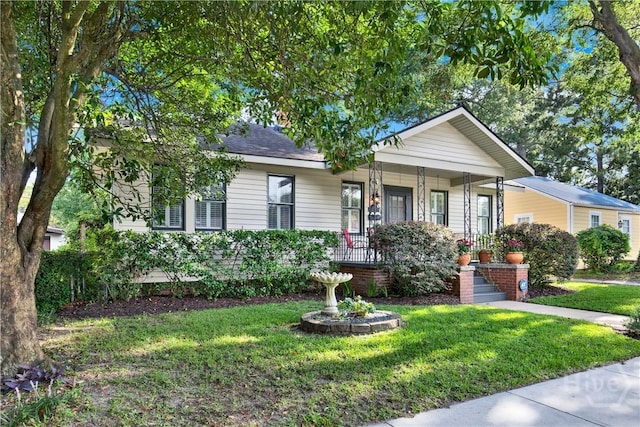 1507 E 49th St, Savannah, GA 31404 - view of front of house with a front yard and a porch