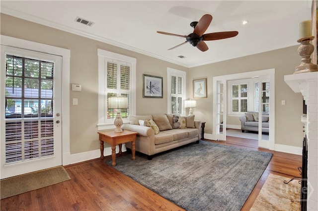 1507 E 49th St, Savannah, GA 31404 - living area with a ceiling fan, ornamental molding, and wood finished floors