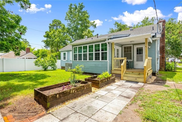 1424 E 53rd St, Savannah, GA 31404 - back of house featuring a vegetable garden and a chimney